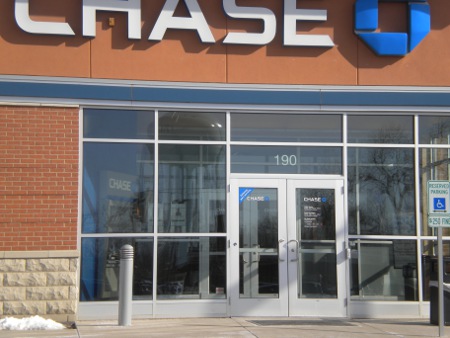 Photo of a bank, showing the entrance to a local branch.